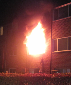 Flames shooting out of apartment window